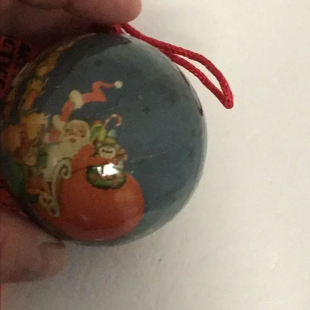 Pair of vintage paper ball Santa Christmas ornaments